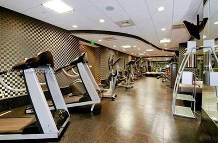 9401 Collins Avenue, Unit 801 Surfside, FL 33154 - Photo 32 of 51 a view of a room with gym equipment