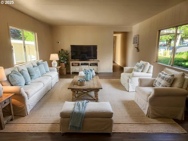 a living room with furniture fireplace and a flat screen tv