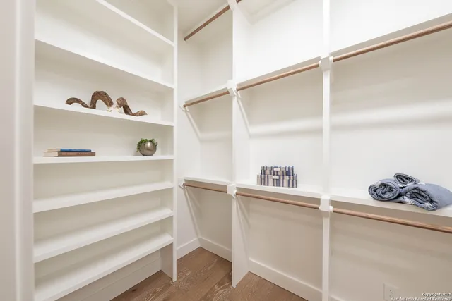 a bedroom with a bed and large window