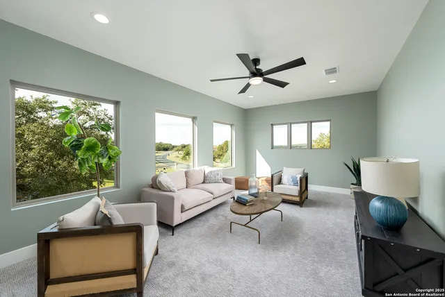 a dining room with furniture and a window