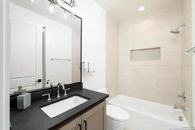 a view of a room with a kitchen