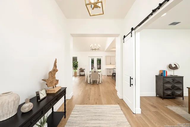 a view of a living room and workspace