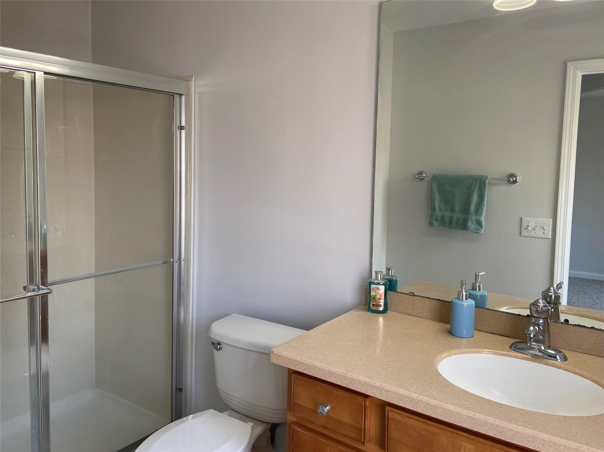 722 Passage Drive Fort Mill, SC 29708 - Photo 11 of 13 a bathroom with a granite countertop sink toilet and a mirror