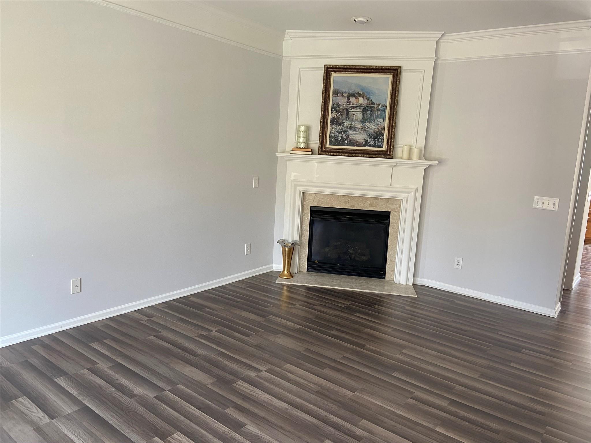 722 Passage Drive Fort Mill, SC 29708 - Photo 4 of 13 a view of an empty room with wooden floor and a fireplace
