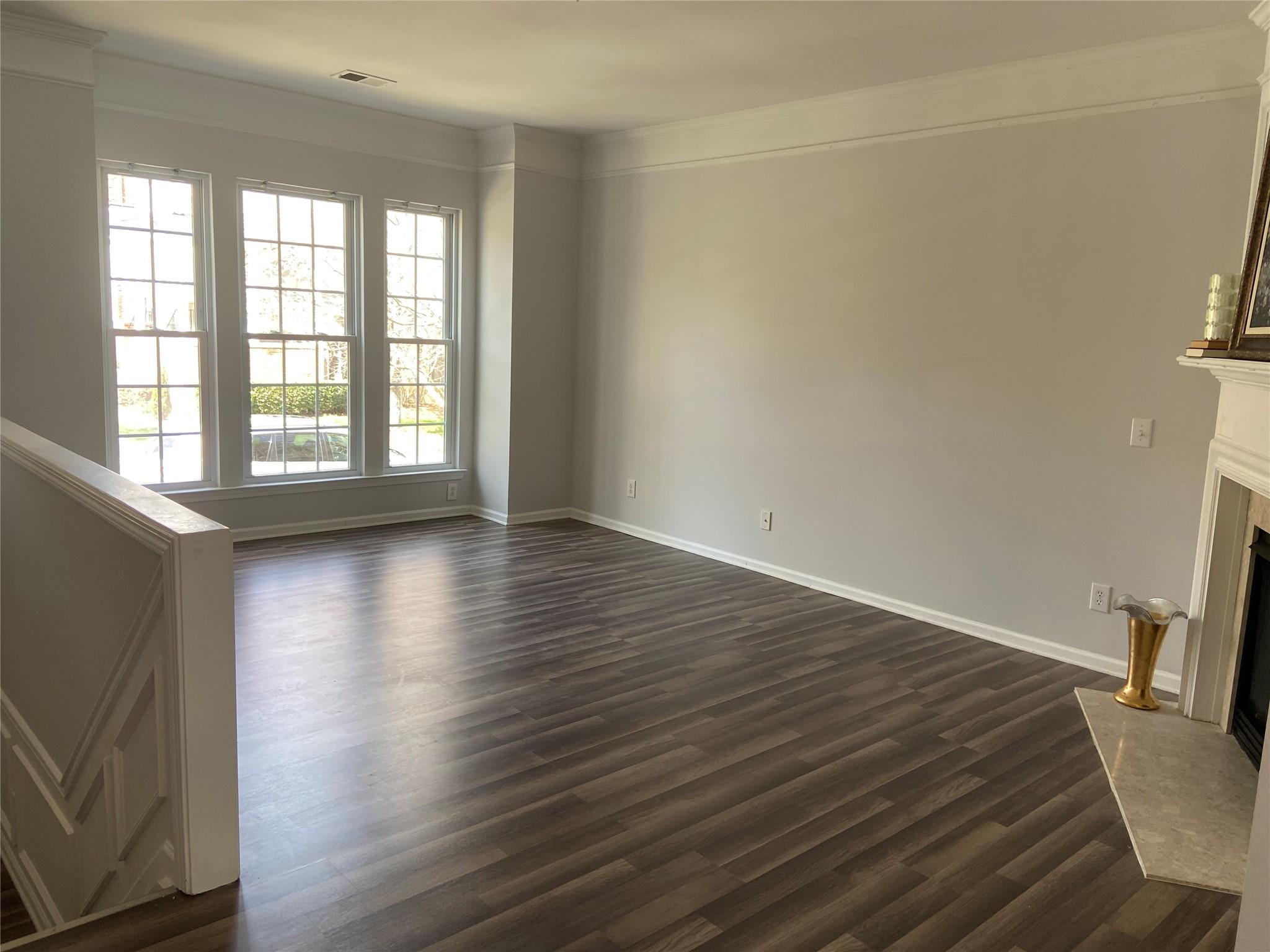 722 Passage Drive Fort Mill, SC 29708 - Photo 5 of 13 a view of an empty room with wooden floor and a window