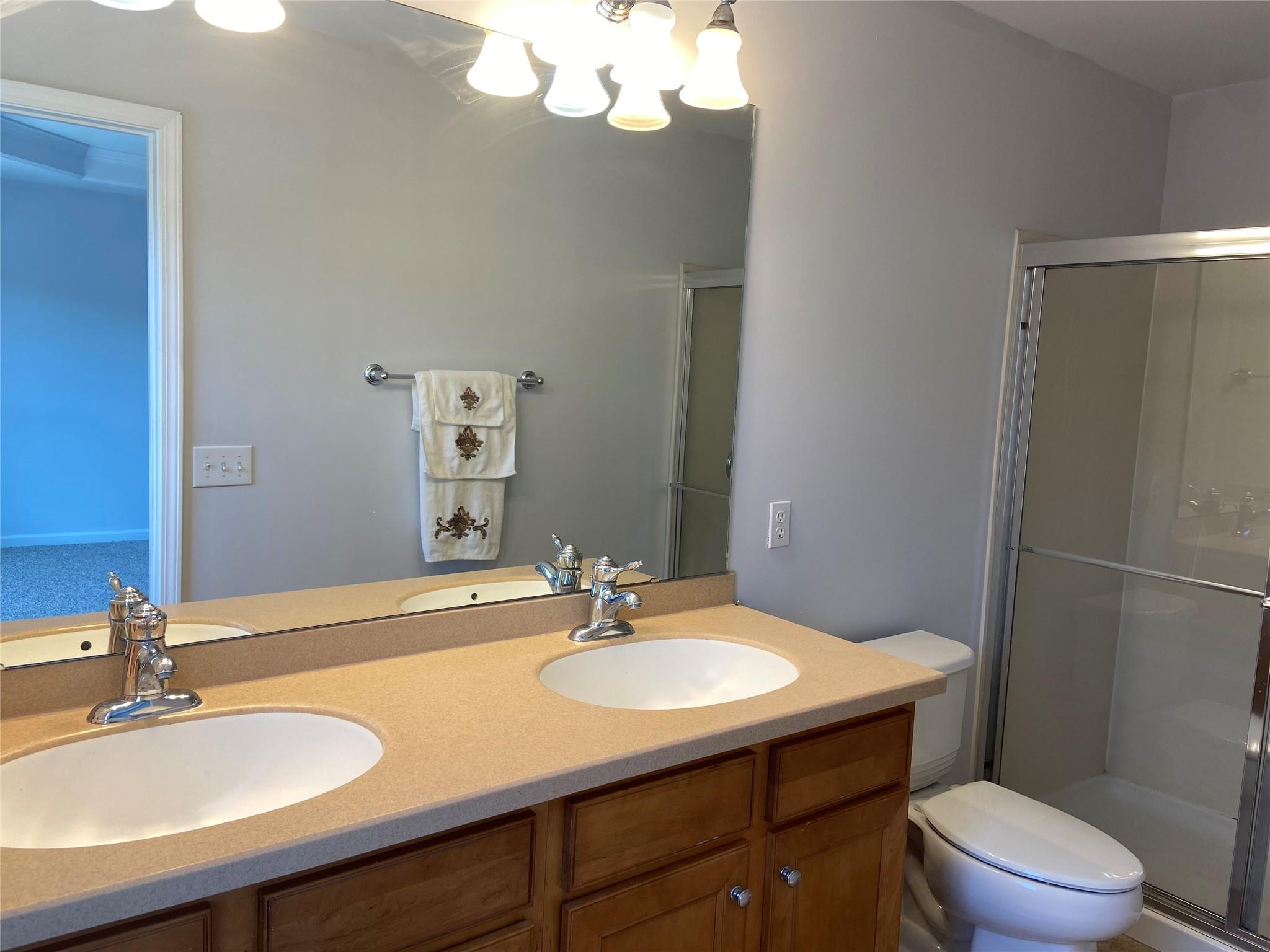 722 Passage Drive Fort Mill, SC 29708 - Photo 9 of 13 a bathroom with a sink a toilet and a mirror