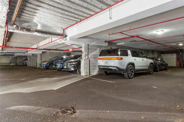a living room with fireplace furniture and a large window