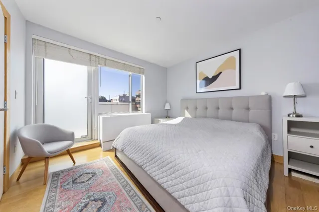 a bedroom with a bed and a chair