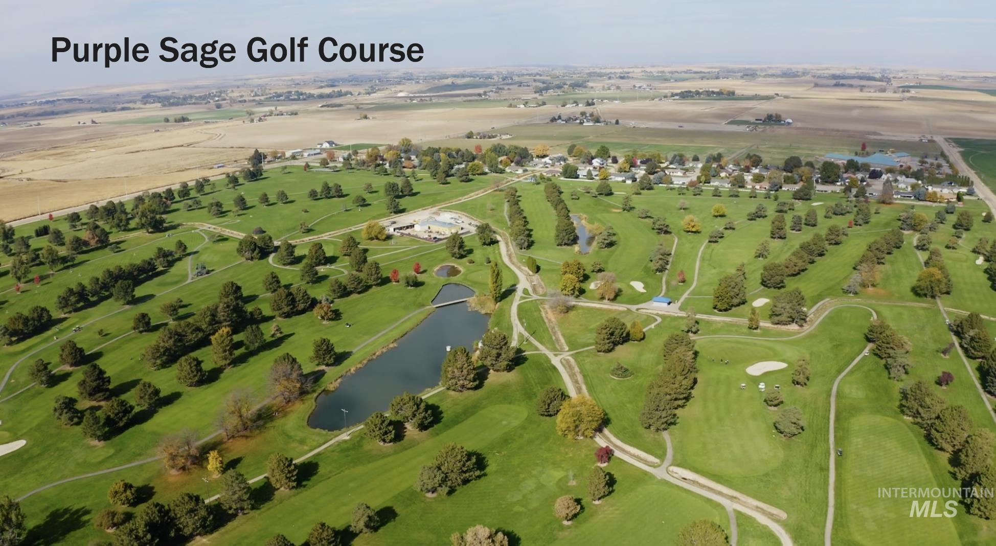 27556 Commerce Comet Way Caldwell, ID 83607 - Photo 2 of 18 Aerial view of property and surrounding area with a nearby body of water and a golf course