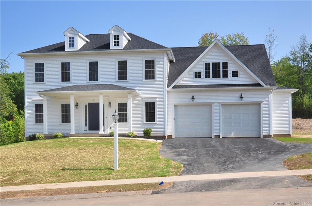 52 Redstone Road Suffield, CT 06078 - Photo 1 of 1 a front view of a house with garden