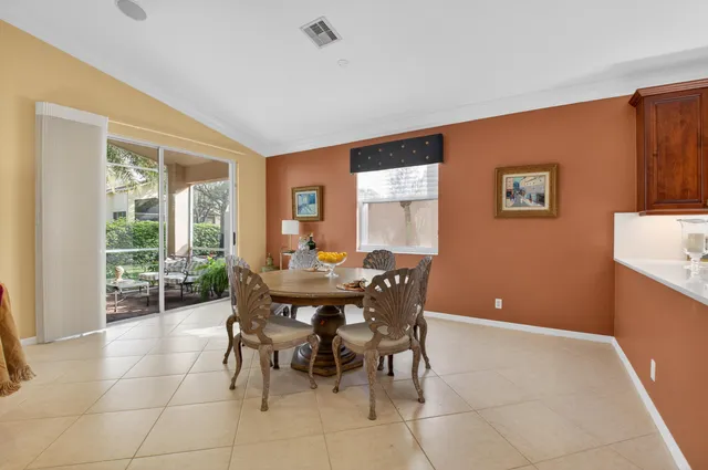 a bedroom with a bed couch and window