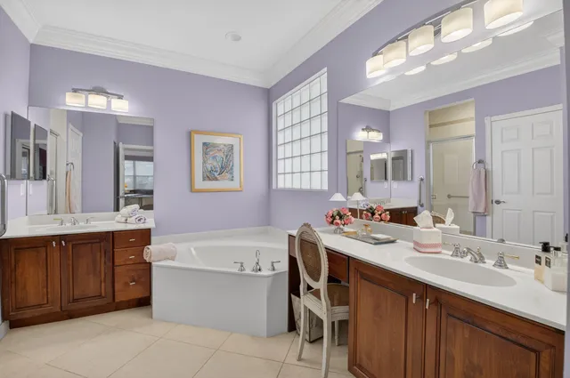 a dining room with furniture and a floor to ceiling window