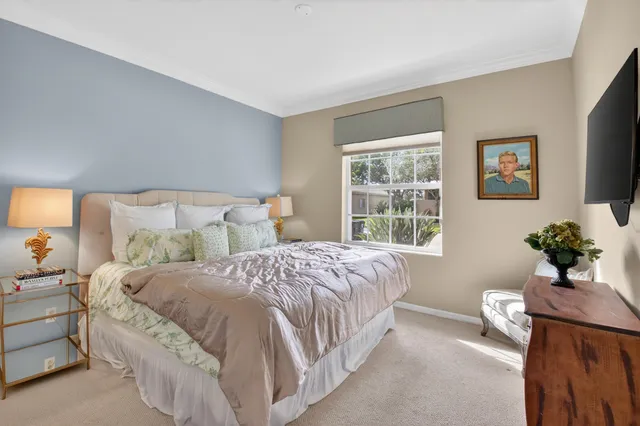 an aerial view of a house with a garden and lake view