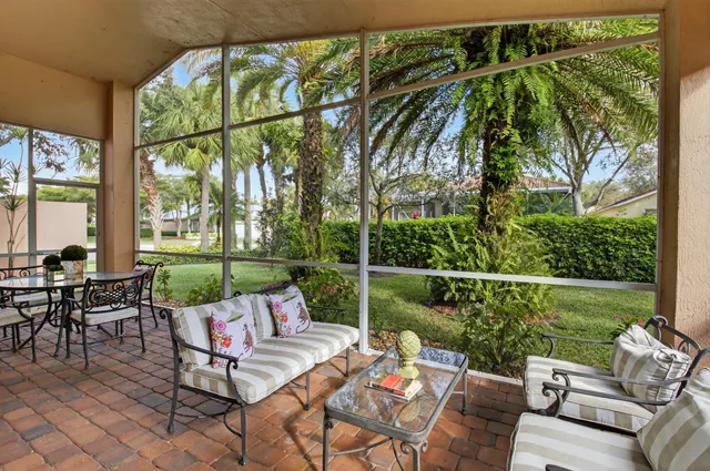 an aerial view of residential houses with outdoor space and street view