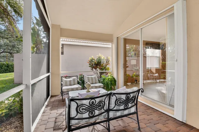 an aerial view of residential houses with outdoor space and street view