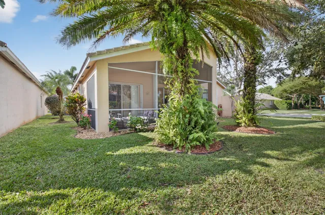 an aerial view of a house with swimming pool outdoor seating and yard