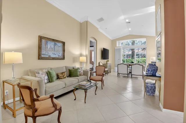 a view of a dining room with furniture and a potted plant