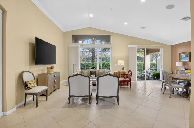 a kitchen with stainless steel appliances granite countertop a refrigerator a stove top oven a sink and dishwasher