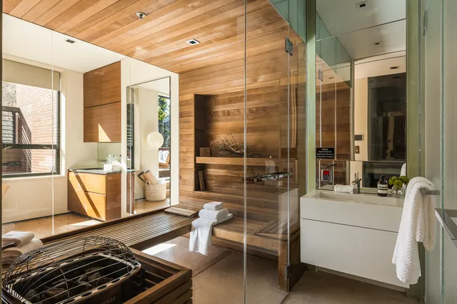 a bedroom with furniture and a large window