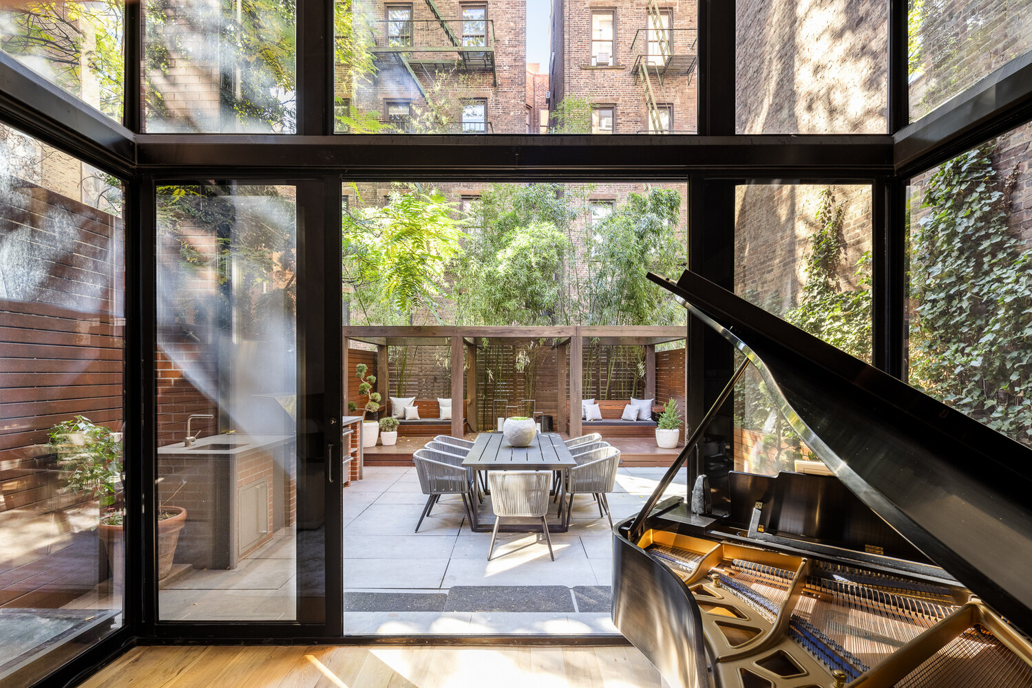 80 West Washington Place Manhattan, NY 10011 - Photo 5 of 33 a living room with a floor to ceiling window and wooden floor