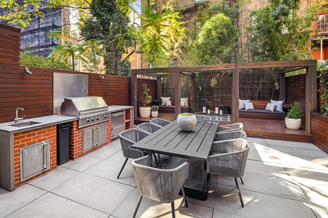 a living room with a floor to ceiling window and wooden floor