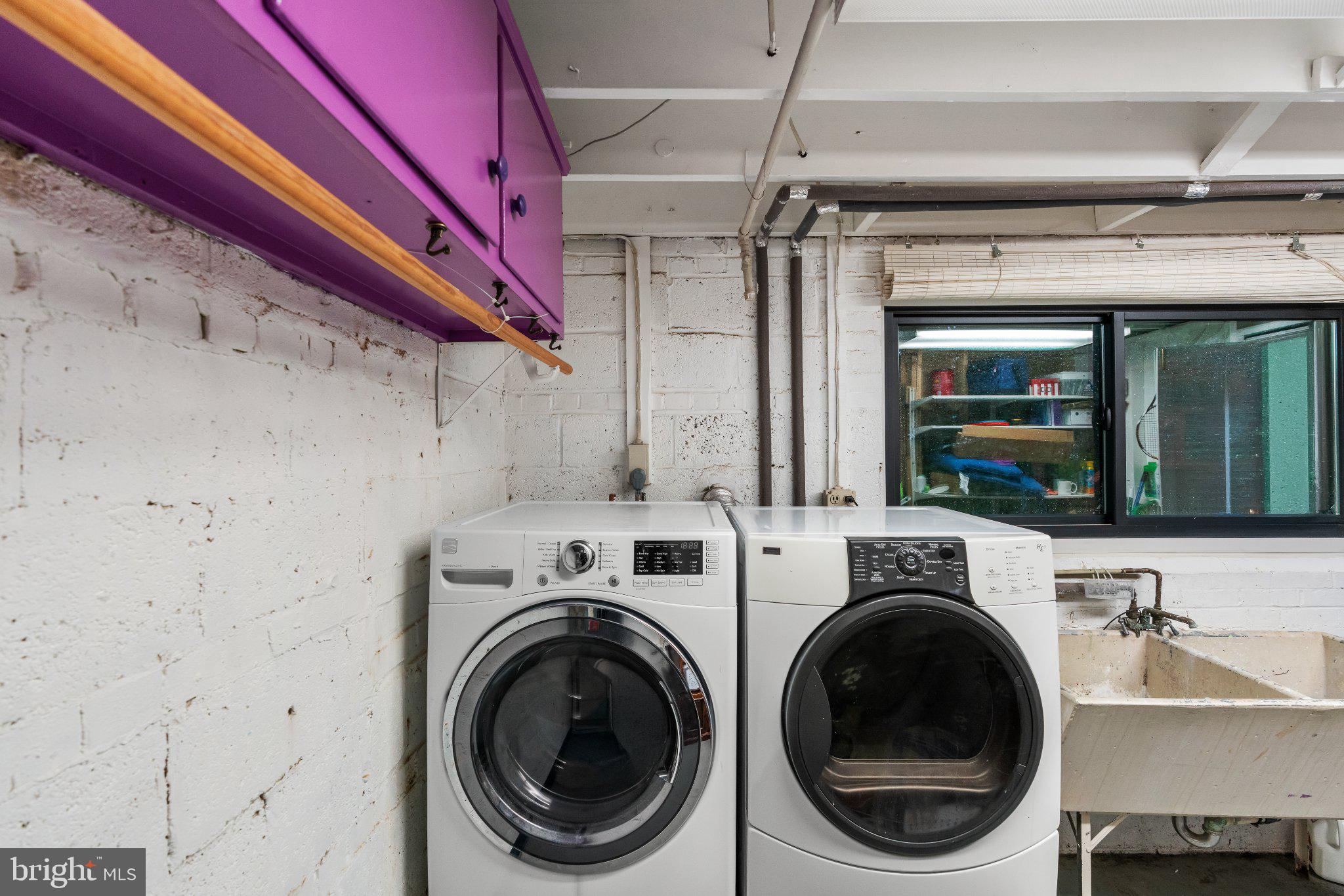 11526 Colt Terrace Silver Spring, MD 20902 - Photo 32 of 37 Modern laundry space with vibrant accents.