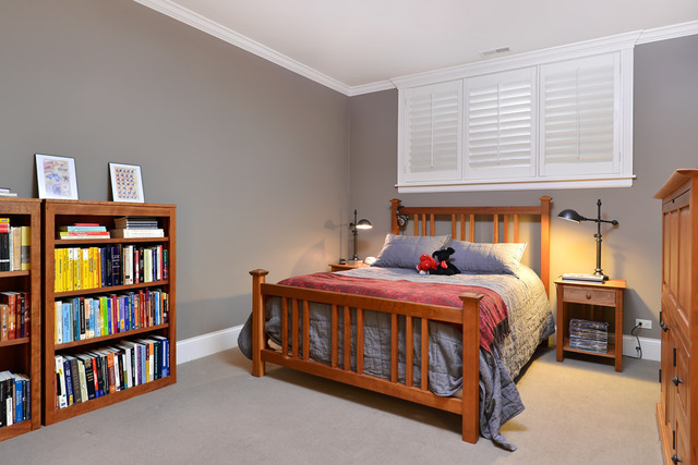 1111 West Wolfram Street Chicago, IL 60657 - Photo 22 of 25 a bedroom with a bed a book shelf and a window