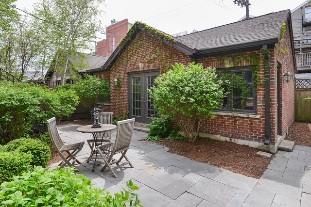 1111 West Wolfram Street Chicago, IL 60657 - Photo 25 of 25 a view of a patio with table and chairs and potted plants