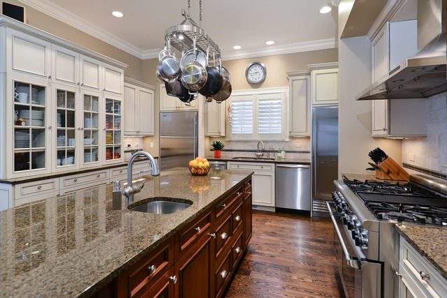 1111 West Wolfram Street Chicago, IL 60657 - Photo 6 of 25 a kitchen with stainless steel appliances granite countertop a sink a stove oven a counter space and cabinets