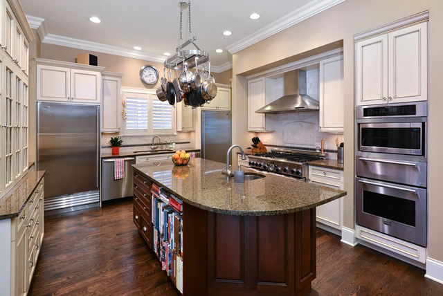 1111 West Wolfram Street Chicago, IL 60657 - Photo 7 of 25 a kitchen with stainless steel appliances granite countertop a sink a stove and a refrigerator