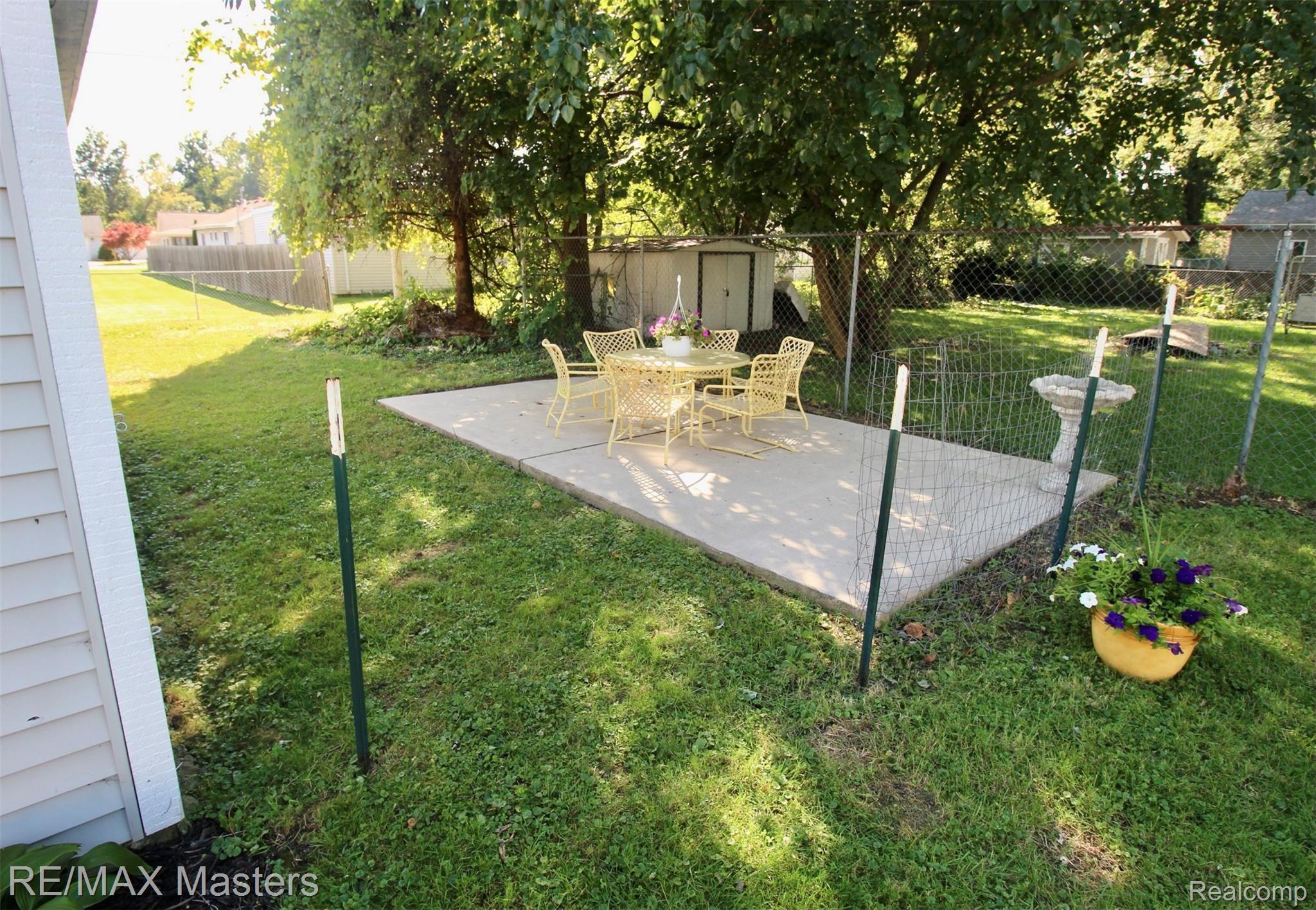 36549 Indiana Road New Boston, MI 48164 - Photo 26 of 29 There's another small patio near the back of the property...a quiet away space for sure