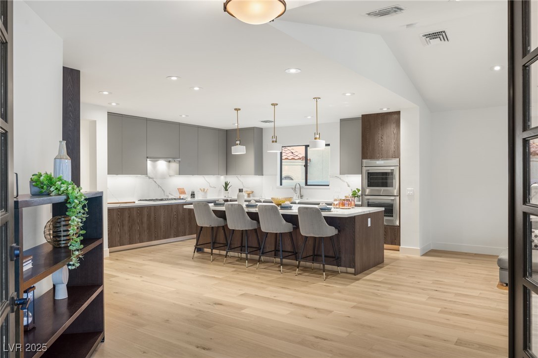 2316 Prometheus Court Henderson, NV 89074 - Photo 15 of 92 Kitchen with double oven, modern cabinets, and light wood-style flooring