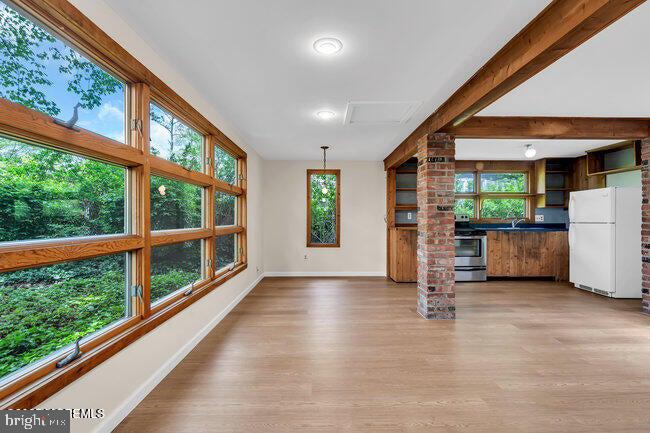 a view of an empty room with a window
