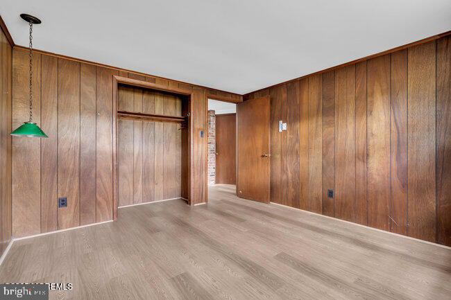 305 Nautilus Boulevard Forked River, NJ 08731 - Photo 22 of 28 a view of an empty room with wooden walls