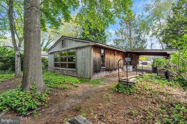 305 Nautilus Boulevard Forked River, NJ 08731 - Photo 24 of 28 a front view of a house with garden