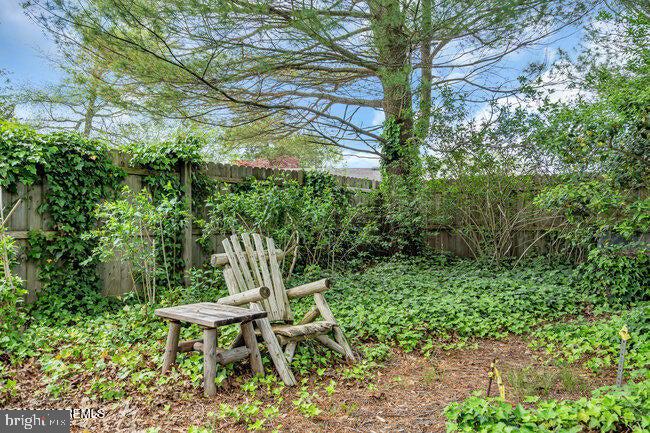305 Nautilus Boulevard Forked River, NJ 08731 - Photo 25 of 28 a table and chair in the garden