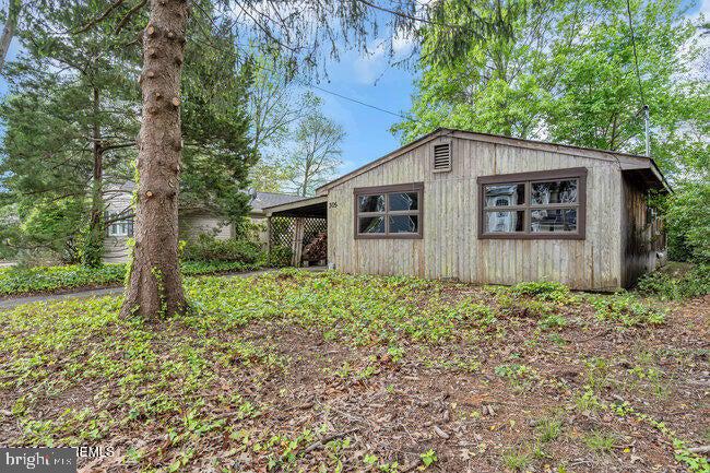 305 Nautilus Boulevard Forked River, NJ 08731 - Photo 28 of 28 a house with trees in the background