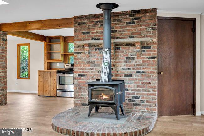 305 Nautilus Boulevard Forked River, NJ 08731 - Photo 4 of 28 a living room with furniture and a fireplace