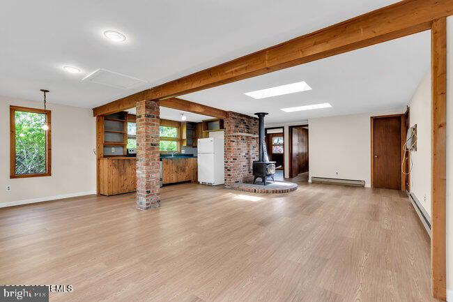 305 Nautilus Boulevard Forked River, NJ 08731 - Photo 8 of 28 an empty room with wooden floor and windows