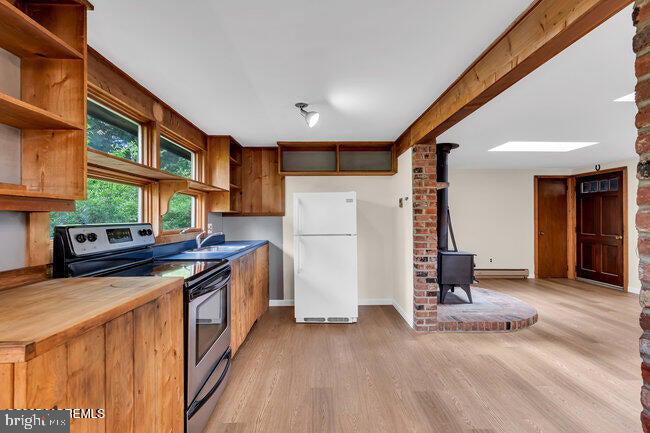 305 Nautilus Boulevard Forked River, NJ 08731 - Photo 9 of 28 a kitchen with stainless steel appliances granite countertop a refrigerator a stove and a sink