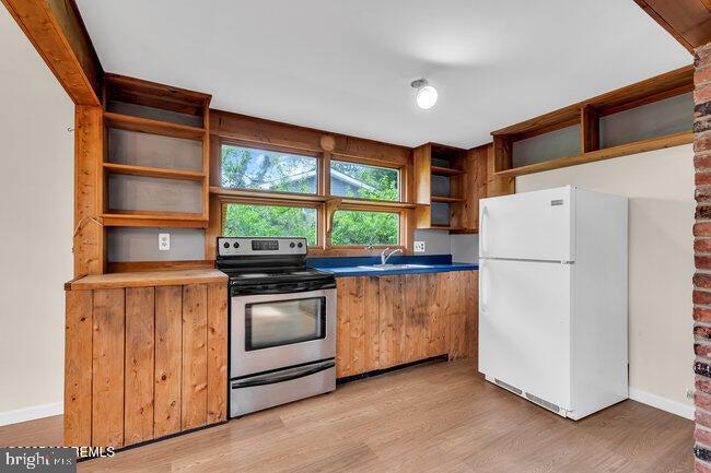 305 Nautilus Boulevard Forked River, NJ 08731 - Photo 10 of 28 a kitchen with stainless steel appliances granite countertop a refrigerator and a stove