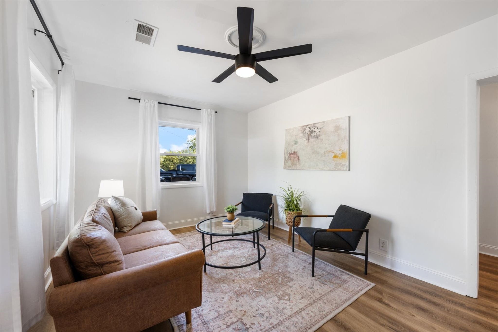 a living room with furniture and a window