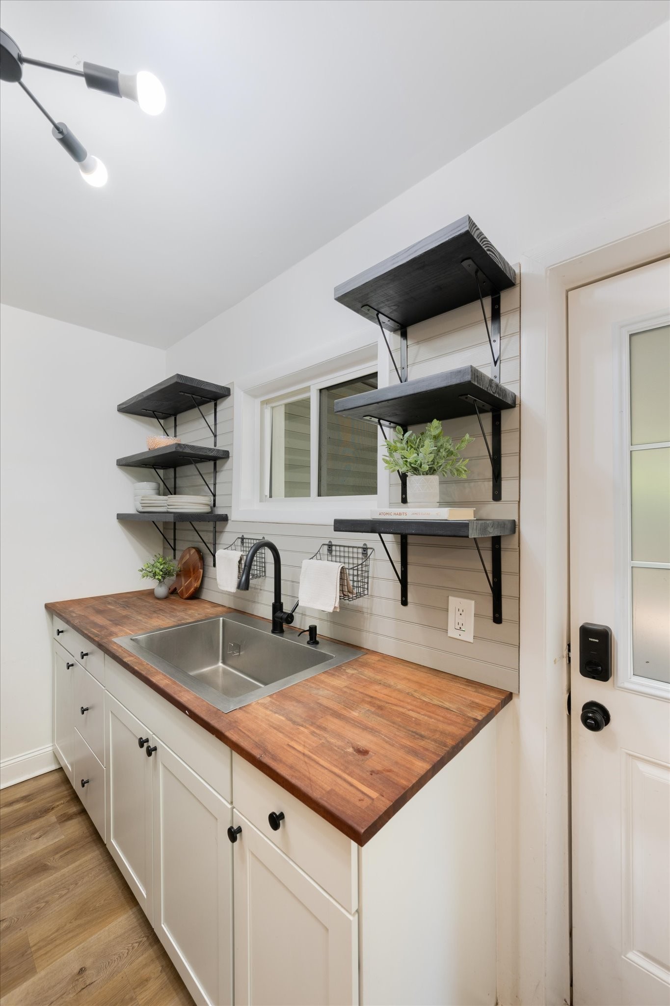 708 Oneida Avenue Nashville, TN 37207 - Photo 4 of 20 a kitchen with kitchen island a sink and a refrigerator