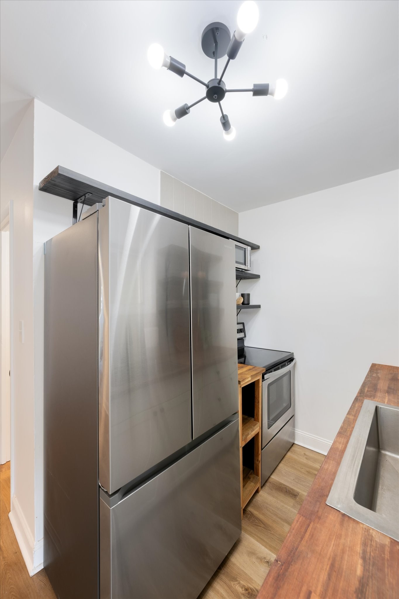 708 Oneida Avenue Nashville, TN 37207 - Photo 5 of 20 a kitchen with stainless steel appliances a refrigerator and a ceiling fan