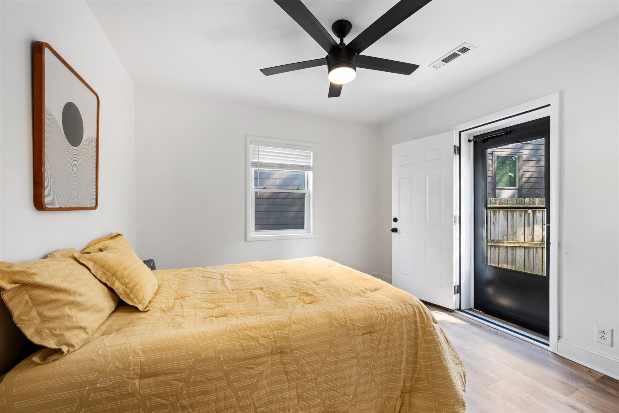 708 Oneida Avenue Nashville, TN 37207 - Photo 6 of 20 a bedroom with a large bed and a chandelier