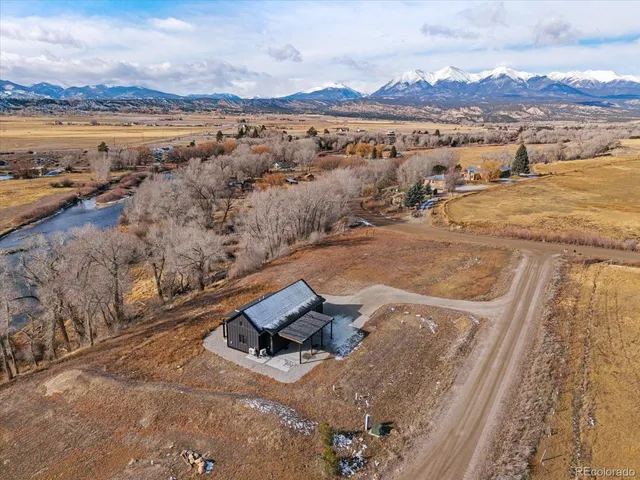 an aerial view of residential houses with outdoor space