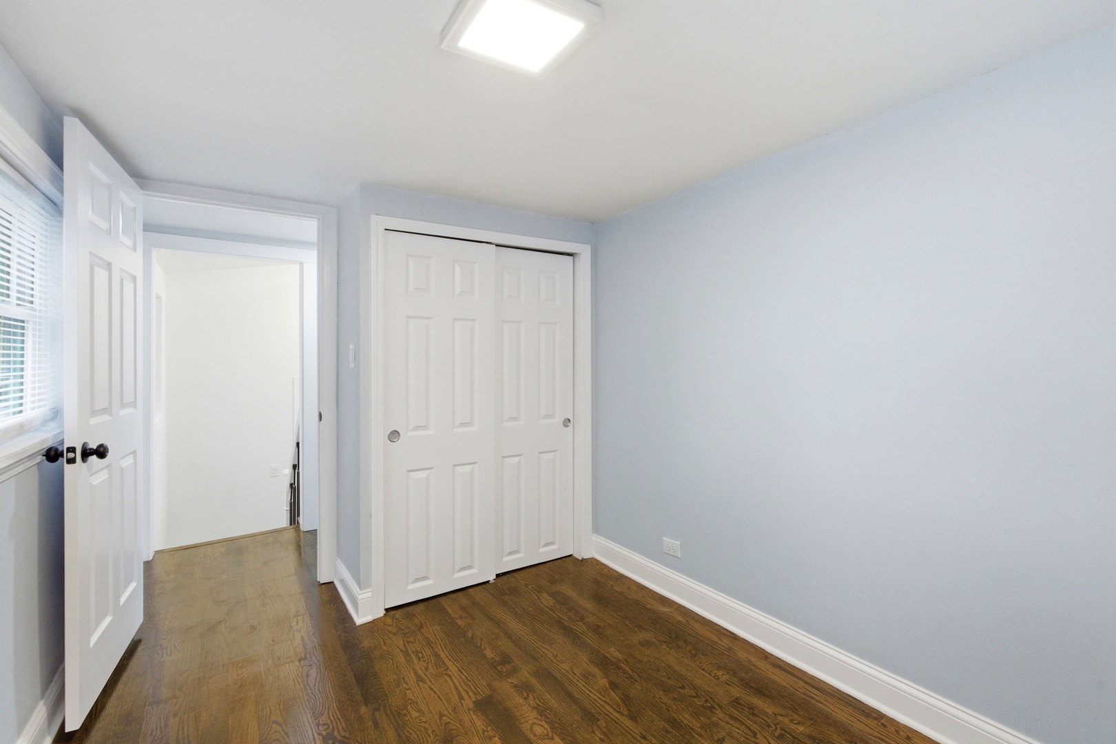 312 East 136th Street Chicago, IL 60827 - Photo 16 of 38 a view of hallway with closet and wooden floor