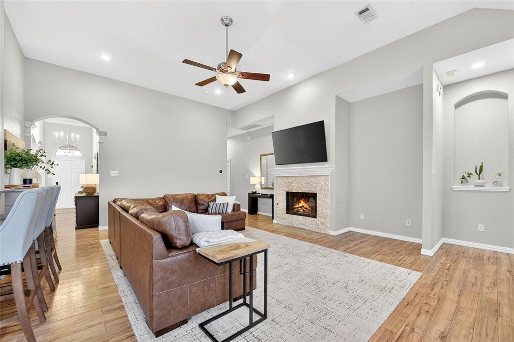 2712 Loon Lake Road Denton, TX 76210 - Photo 20 of 40 Living with cozy wood burning fireplace