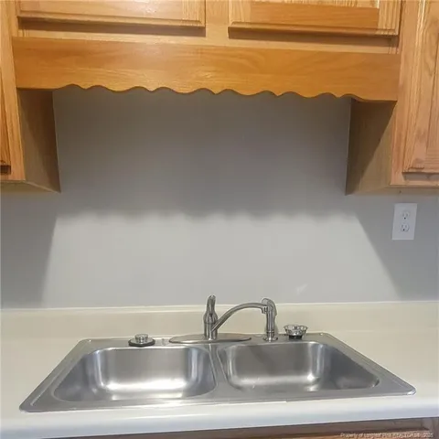 a utility room with a sink a washer and dryer