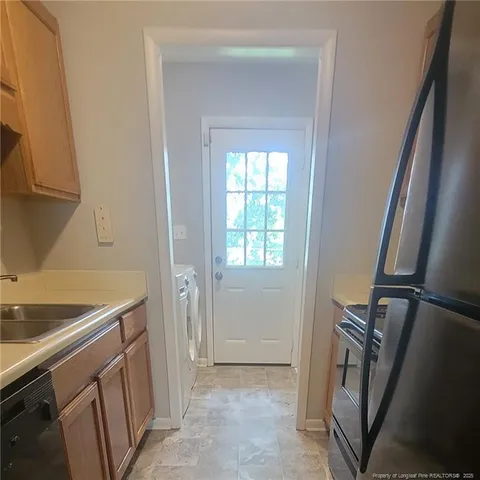 a view of a livingroom with furniture and window